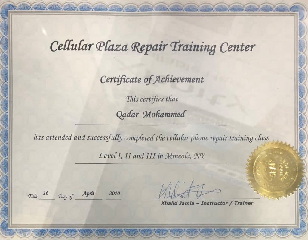 A framed certificate of completion for a cellular phone repair training course, displayed in the shop.